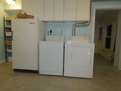 After, all the appliances on one wall, and actual cabinets above them.