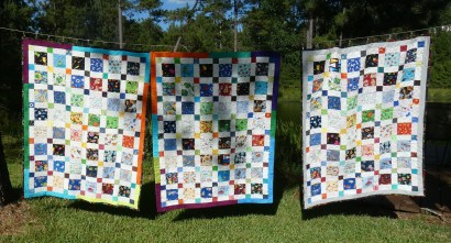 Three finished I Spy quilts. I have one more top to go.